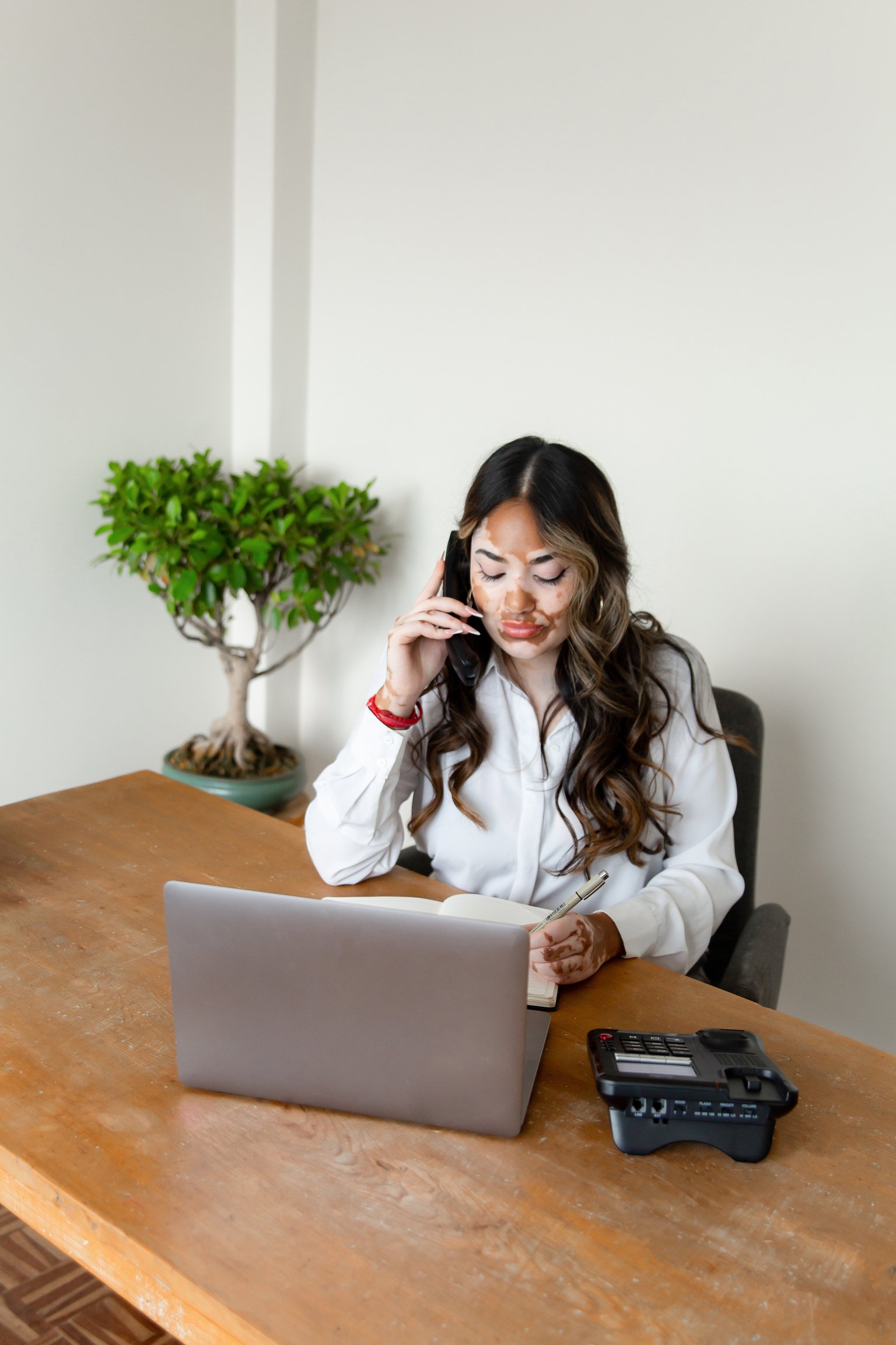 Customer Support Specialist Taking Calls on Telephone